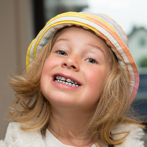 Child with braces smiling True Orthodontics PC